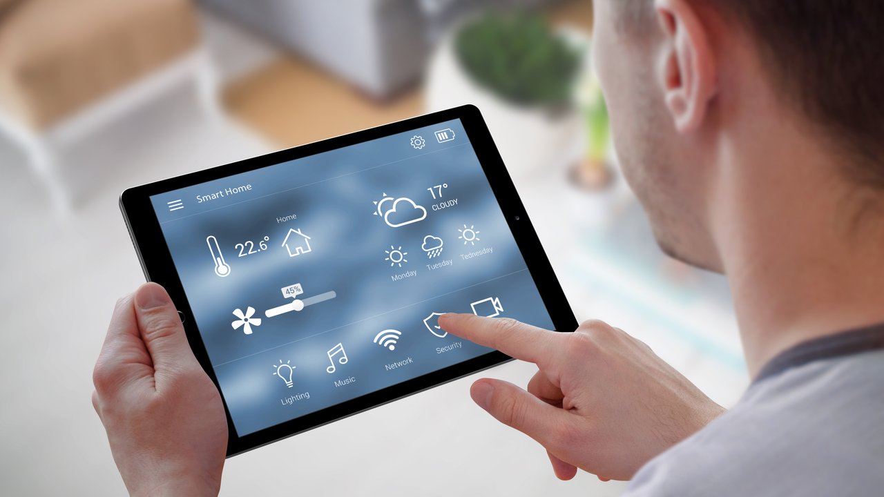 An over the head shot of a man managing home heating