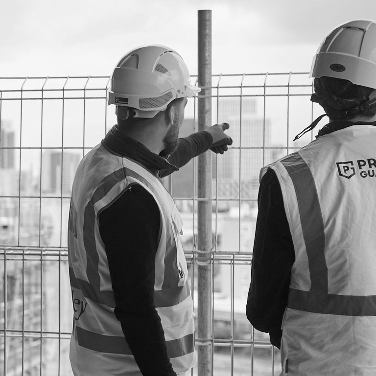 Premier Guarantee Surveyor talking to client on building site