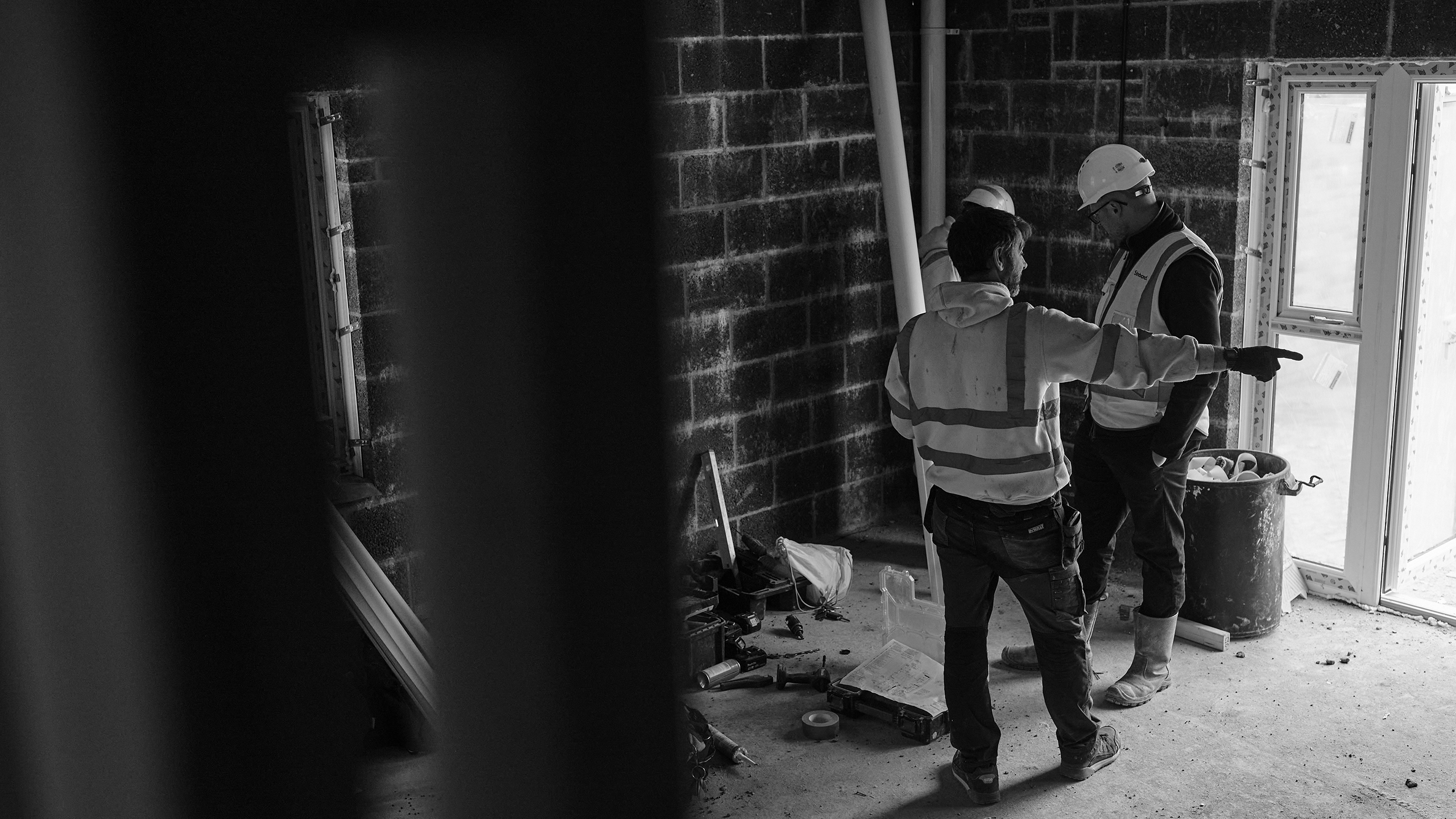 Social Housing Two workmen on building site inspection for social housing warranty