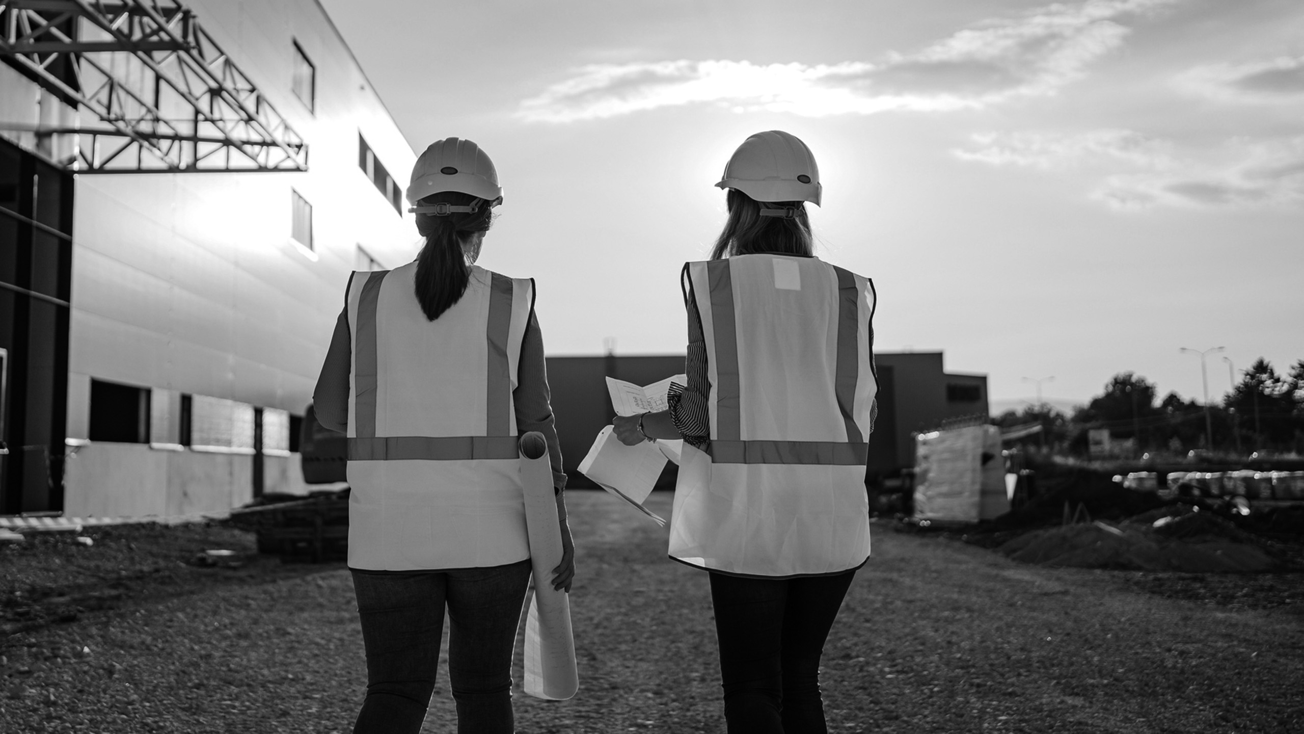 Structural Warranty Two female inspectors on building site