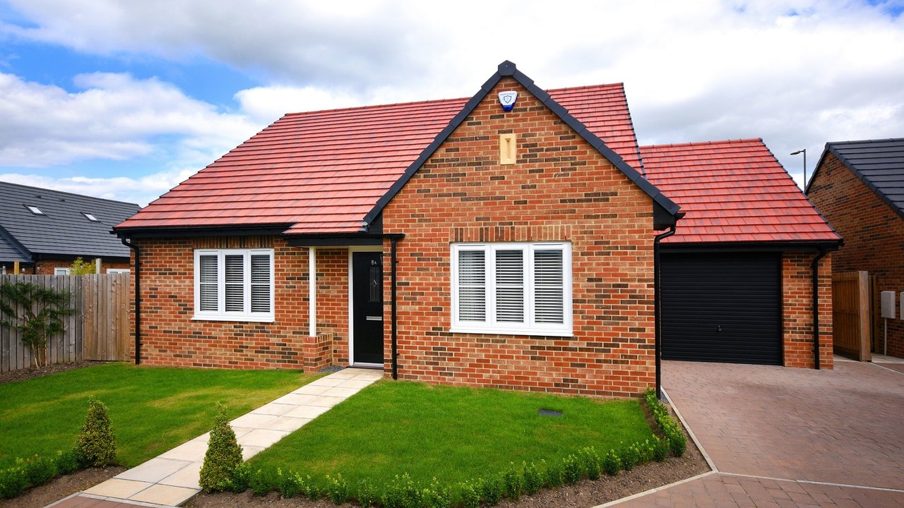 Red brown brick new build bungalow by Amethyst Homes