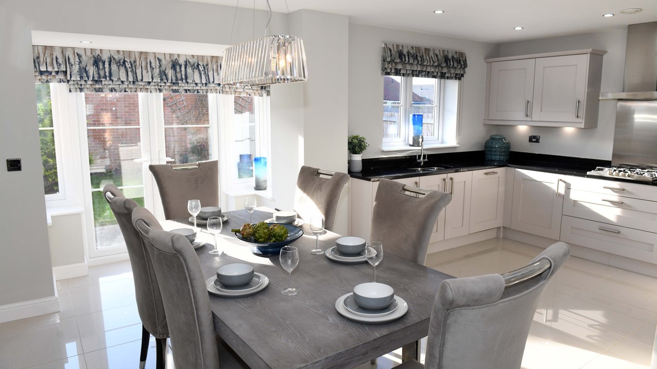 Inside of an Amethyst Homes showhome - kitchen view with grey and white decor