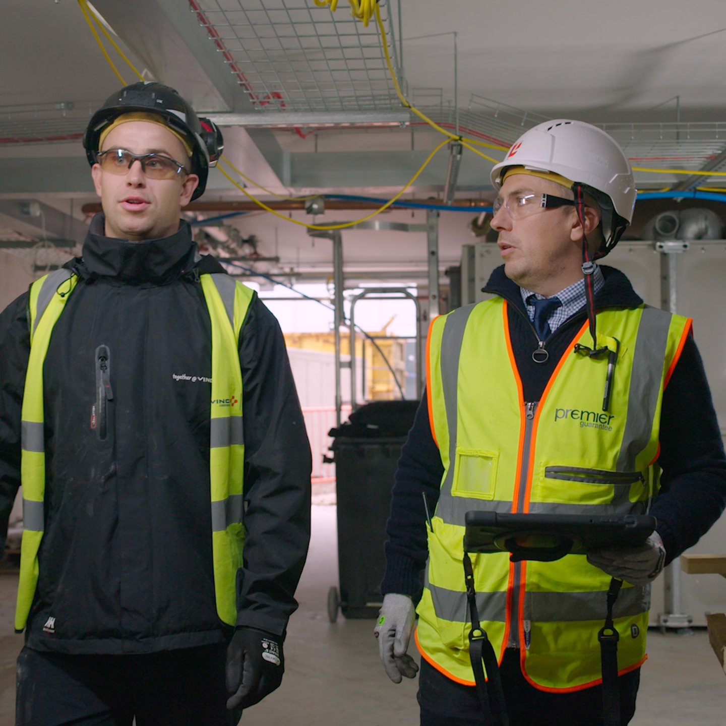 Redrow Site in construction - Redrow Case Study 3 Redrow Site in construction with Site Managers inspecting brickwork