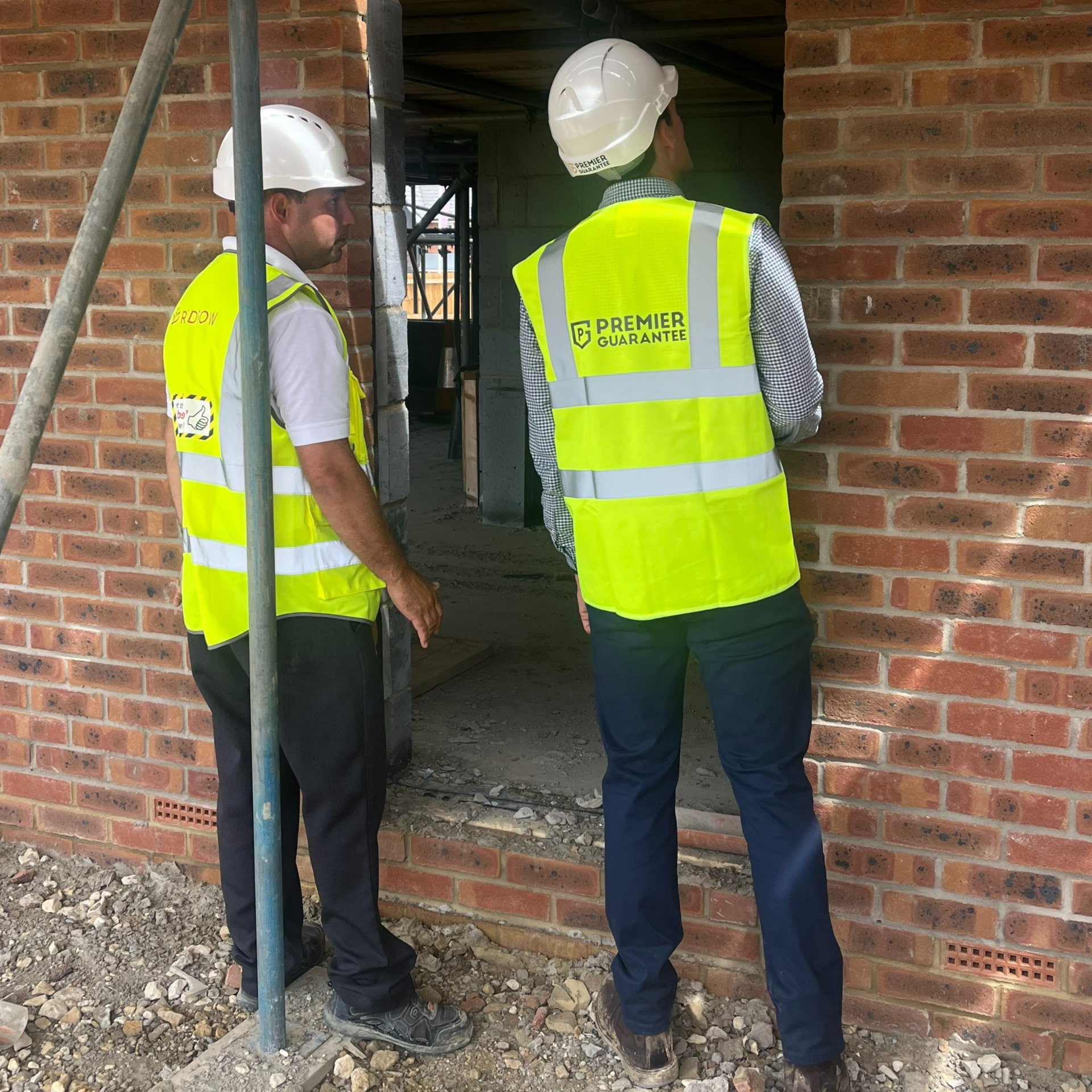 Redrow Site being inspected - Redrow Case Study 4 Redrow site in construction, doorways being inspected.