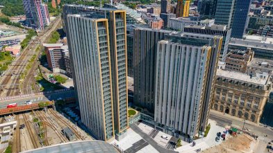 Aerial shot of tall building developed by Muse Developments & Vinci Construction UK Ltd called New Victoria