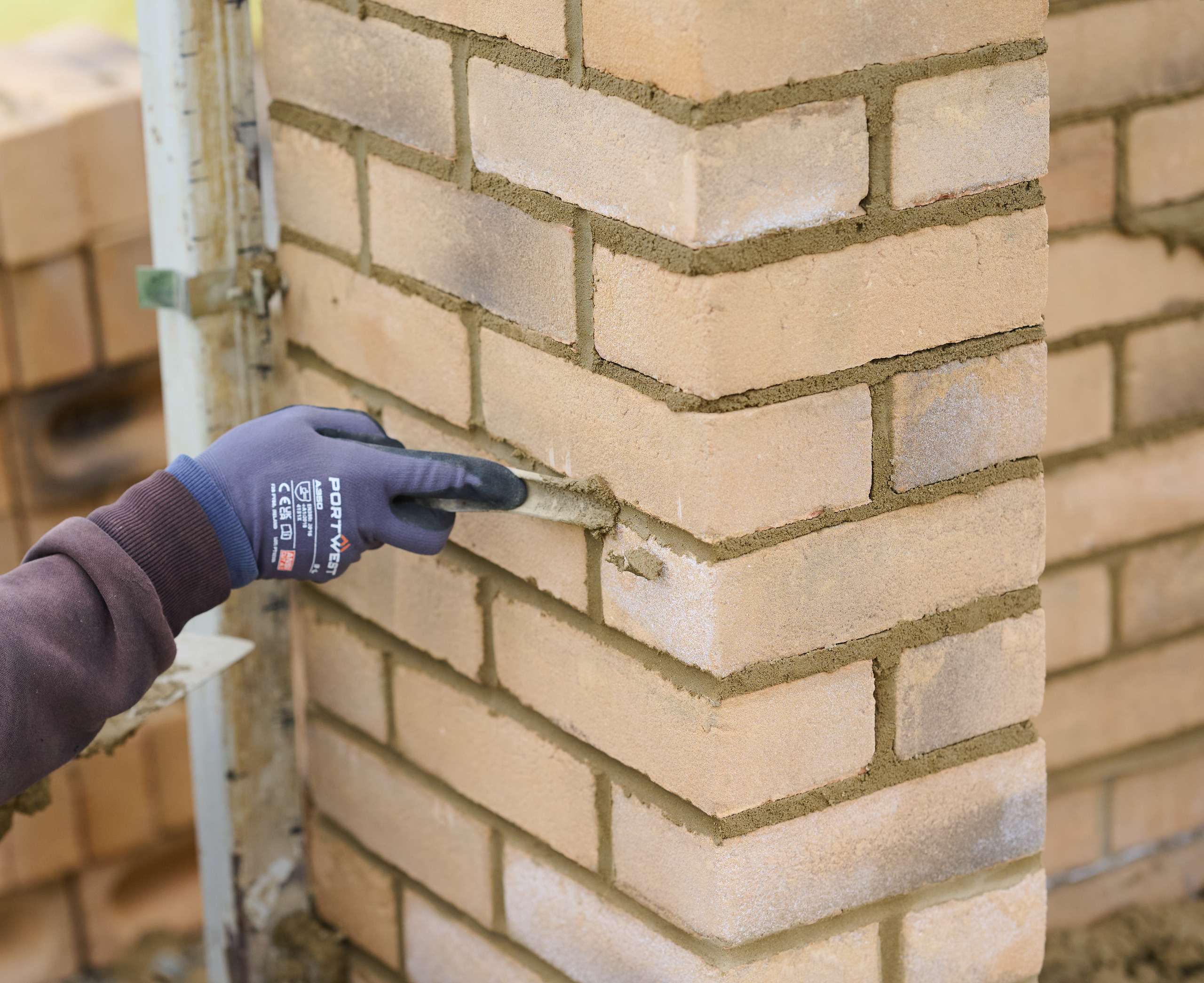 Filling in the mortar joints on masonry wall Filling in the mortar joints on masonry wall