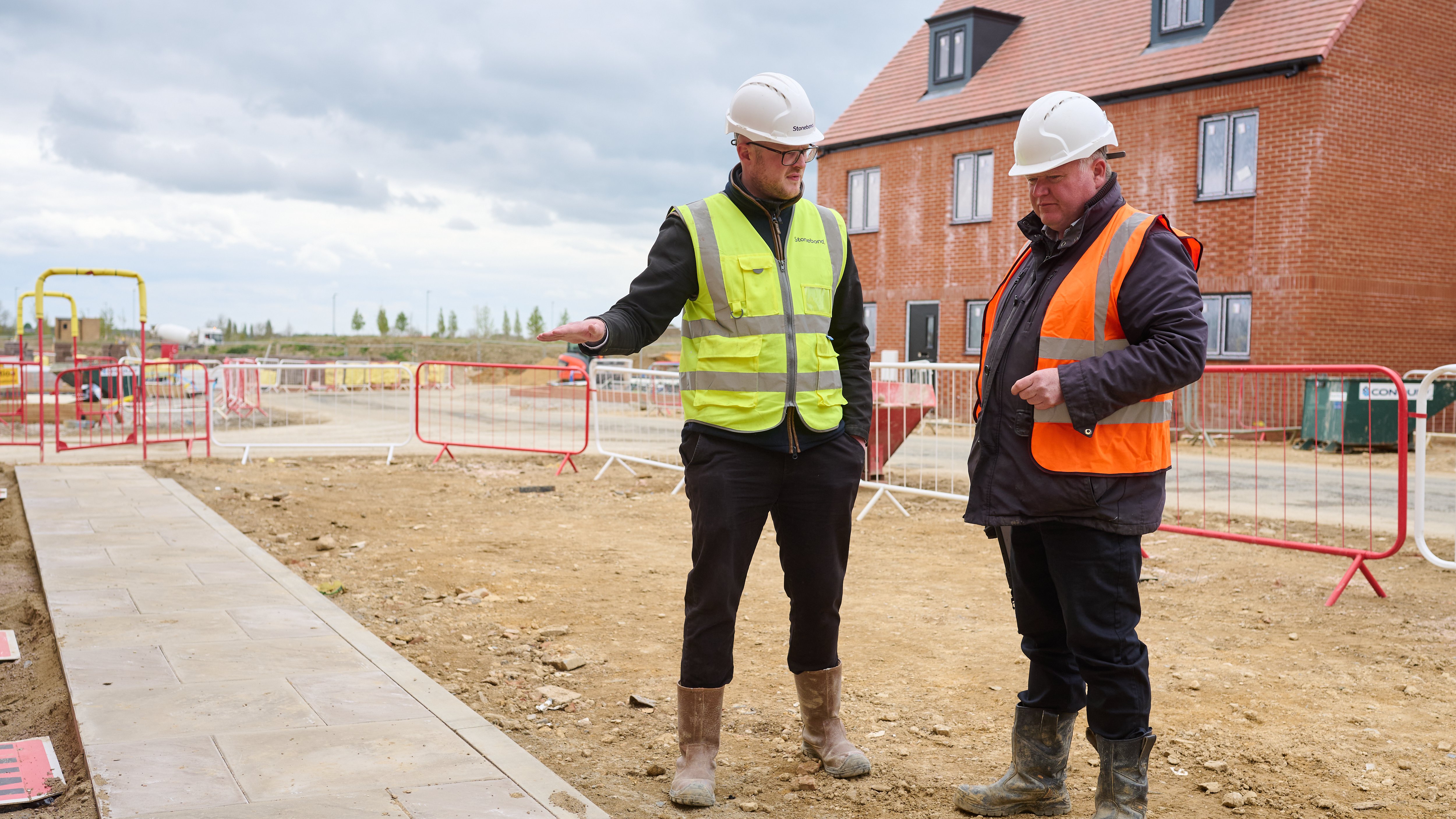 Premier Guarantee inspector at a building site with Stonebond site manager