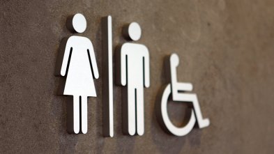 Clearing blocked pipe toilet Image of a female, male, and disabled toilets sign