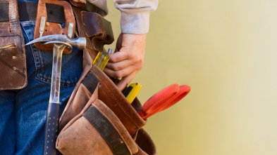 DIY and Maintenance Image of a man's waist with holster full of tools