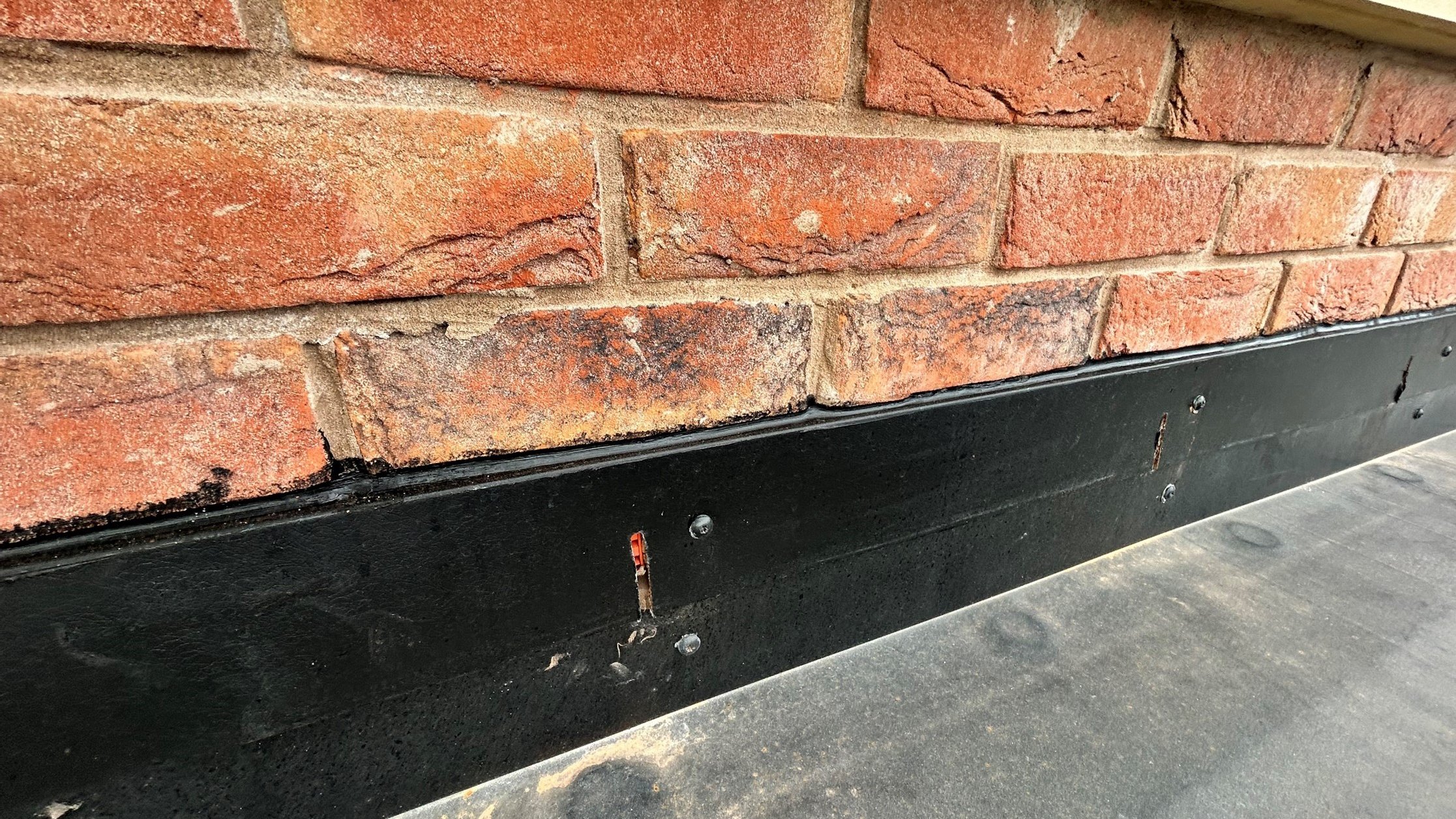 Image showing an example of incorrect detailing at a roof abutment.